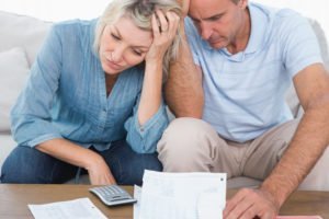 Man and woman reviewing medical bills