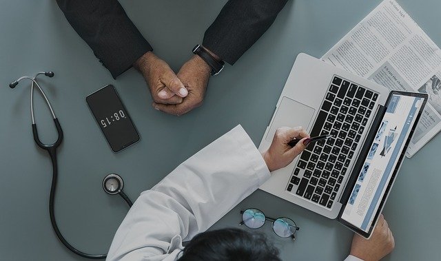 doctor and patient looking at computer