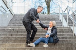 Slip And Fall Lawyer On Stairs Helping