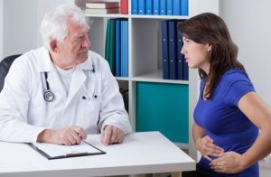 Woman talking to doctor