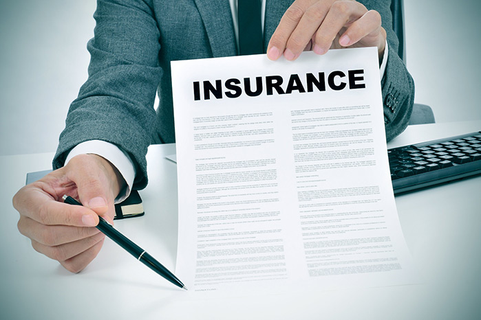 Insurance adjuster with paperwork